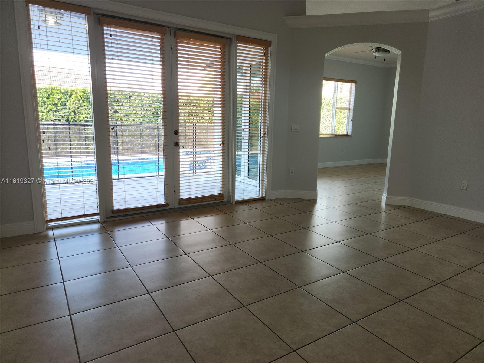 14201 Southwest 15th Street Miami, FL 33184 - Photo 6 of 37 a view of an empty room with a window