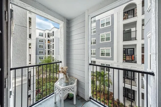 a view of a balcony with outdoor seating