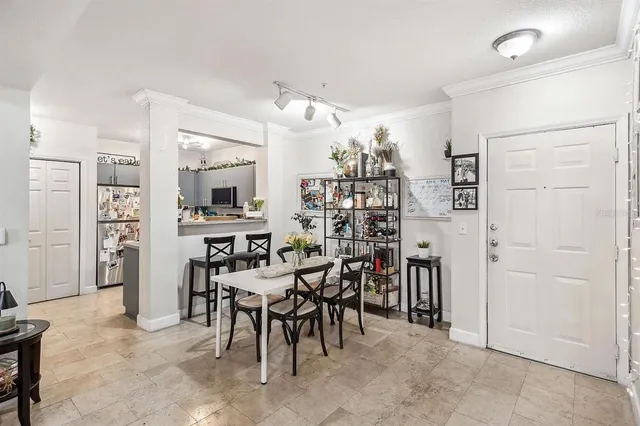 a view of a livingroom and a dining room with furniture