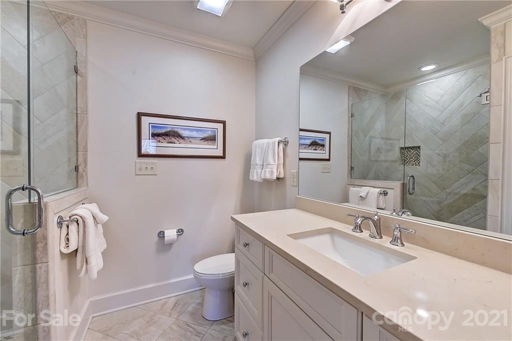 3400 Sharon Road Charlotte, NC 28211 - Photo 17 of 38 a bathroom with a granite countertop sink mirror and toilet