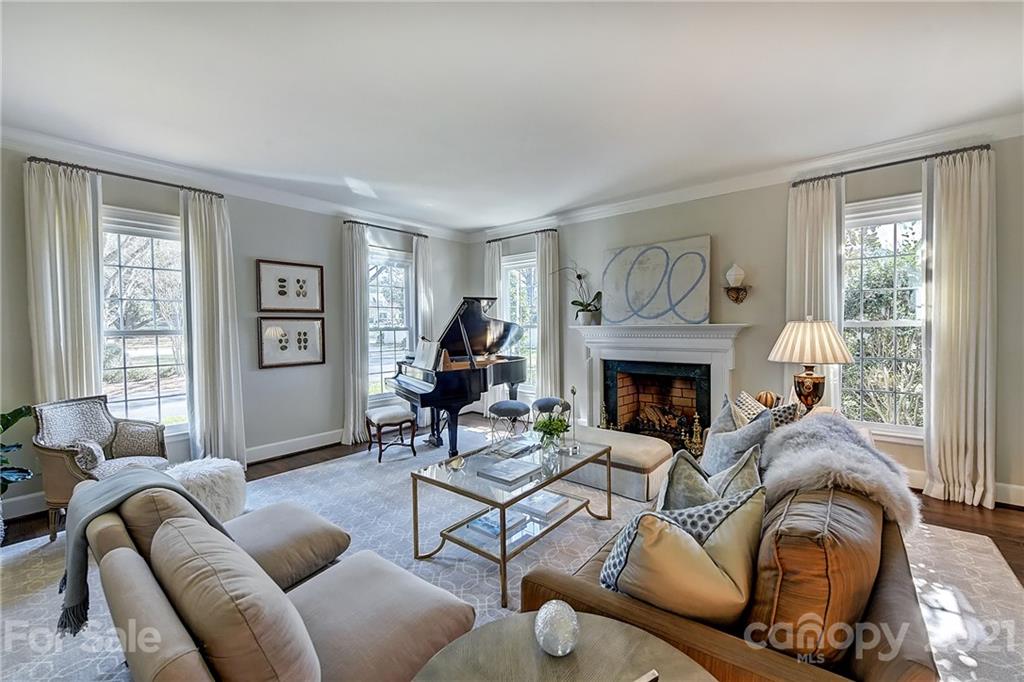 3400 Sharon Road Charlotte, NC 28211 - Photo 3 of 38 a living room with furniture a window and a fireplace