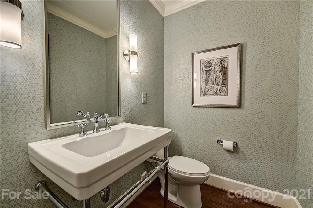 3400 Sharon Road Charlotte, NC 28211 - Photo 24 of 38 a bathroom with a sink toilet and a mirror