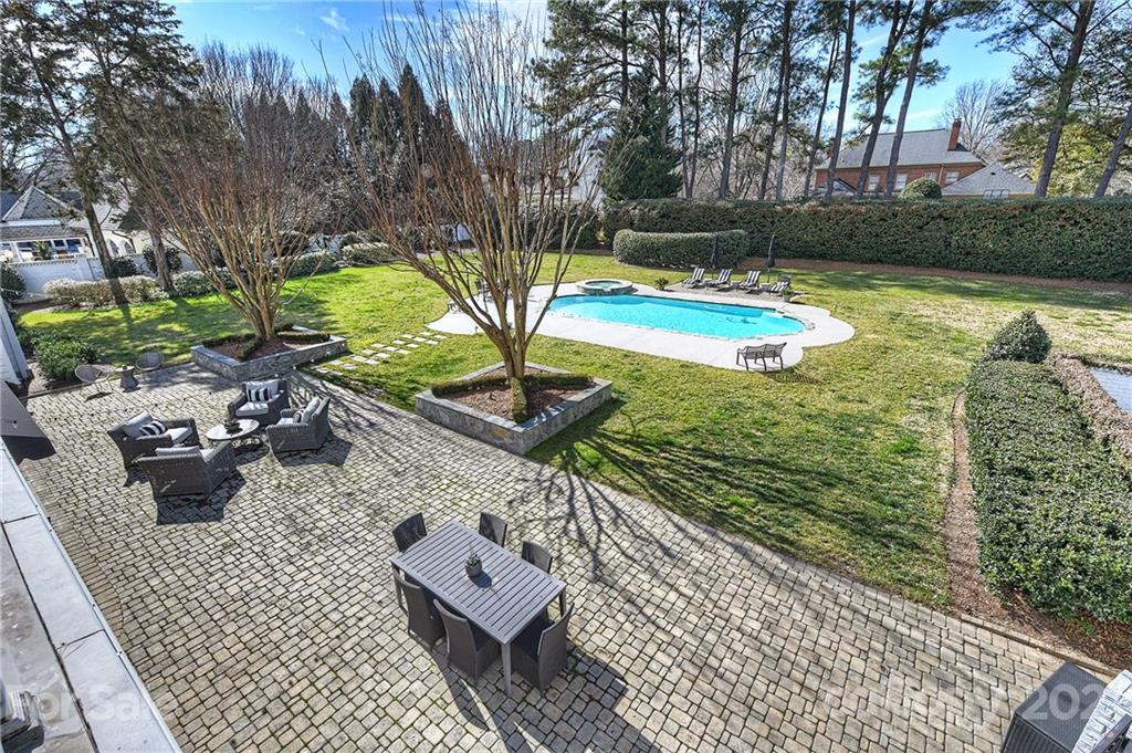 3400 Sharon Road Charlotte, NC 28211 - Photo 27 of 38 a view of a swimming pool with a patio and a yard