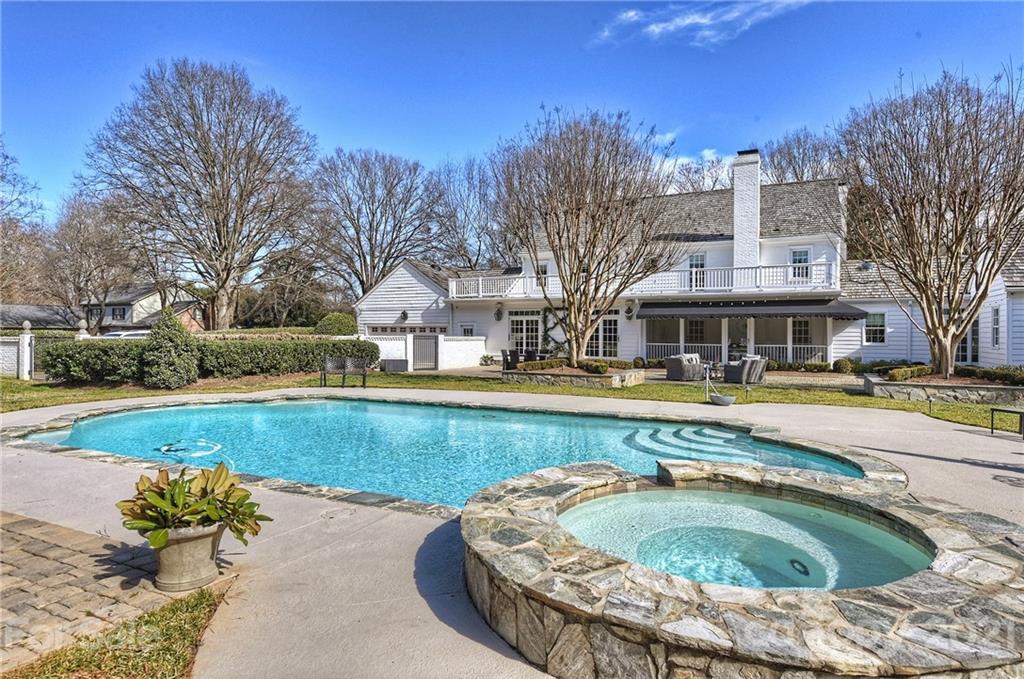 3400 Sharon Road Charlotte, NC 28211 - Photo 28 of 38 a swimming pool with outdoor seating and yard