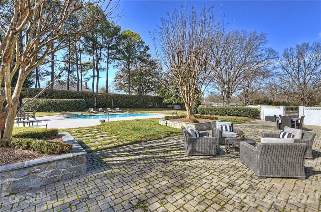 3400 Sharon Road Charlotte, NC 28211 - Photo 29 of 38 a view of a swimming pool with a patio
