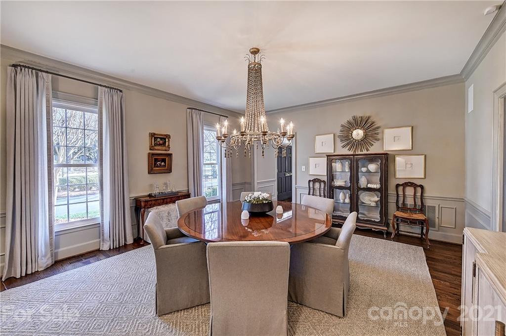 3400 Sharon Road Charlotte, NC 28211 - Photo 4 of 38 a dining room with furniture a chandelier and window
