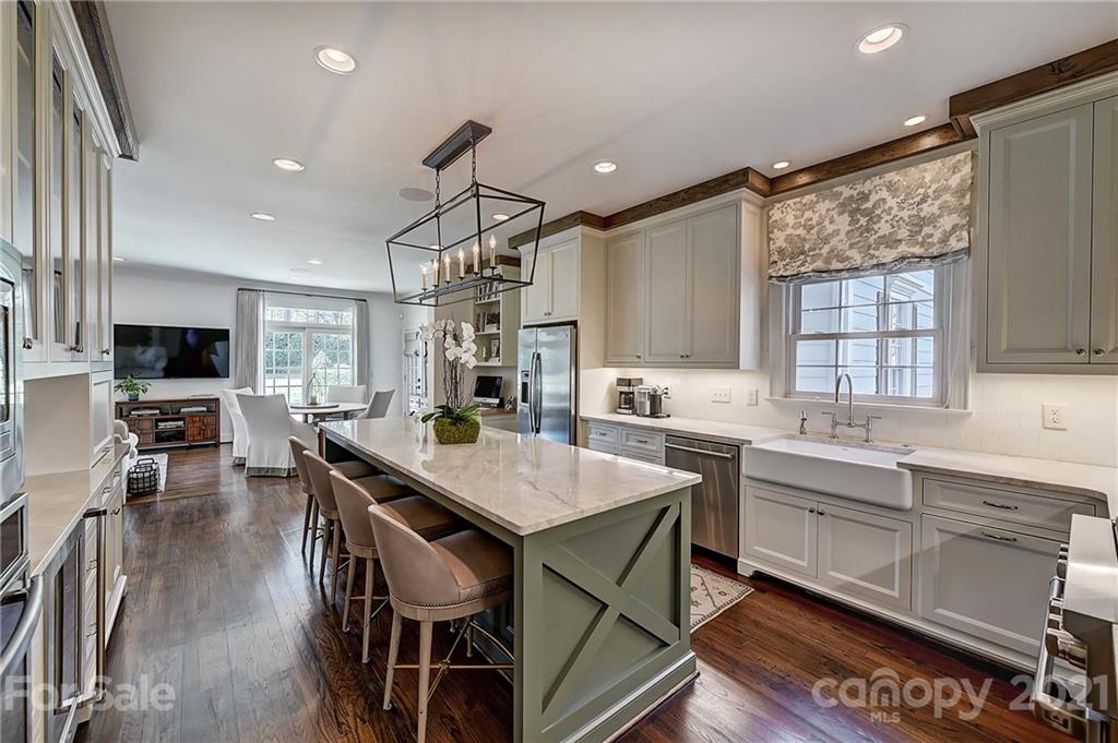 3400 Sharon Road Charlotte, NC 28211 - Photo 6 of 38 a kitchen with lots of counter top space and dining table