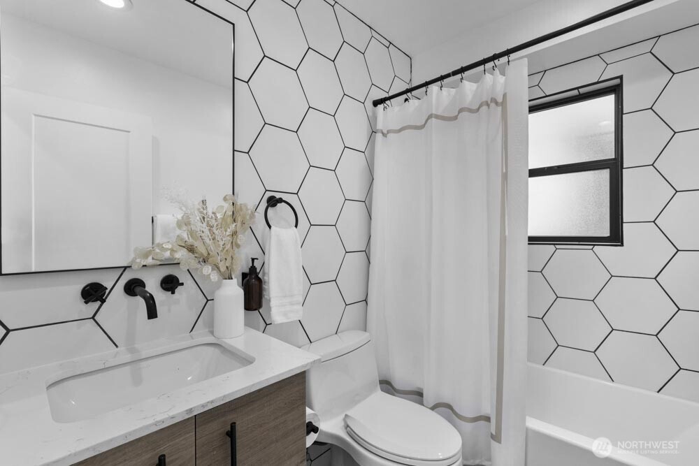 5926 34th Avenue Southwest Seattle, WA 98126 - Photo 17 of 36 a bathroom with a sink toilet and shower