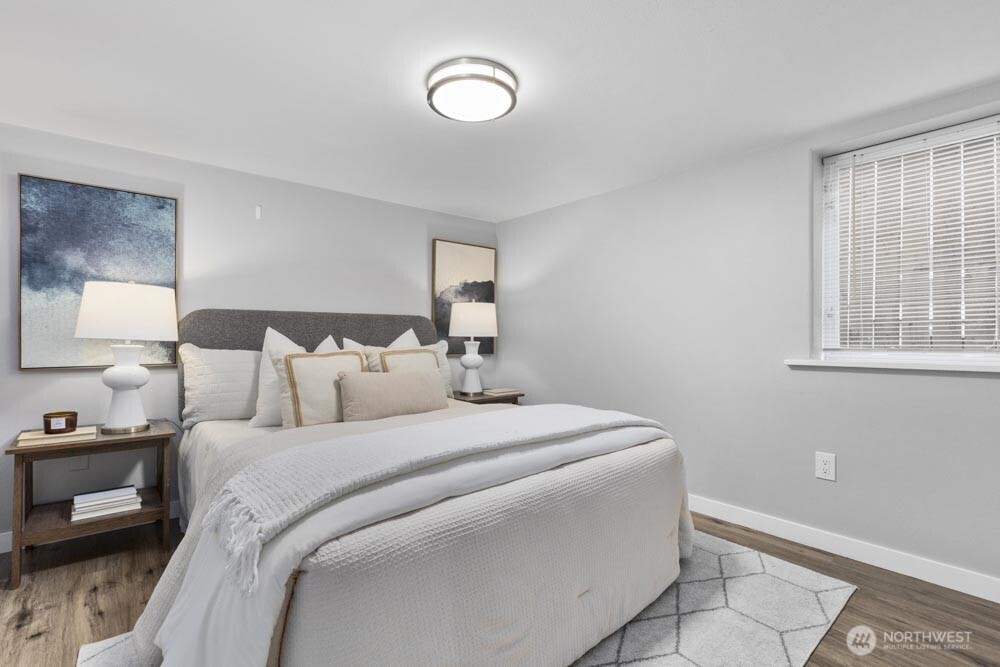 5926 34th Avenue Southwest Seattle, WA 98126 - Photo 23 of 36 a bedroom with a bed and a window