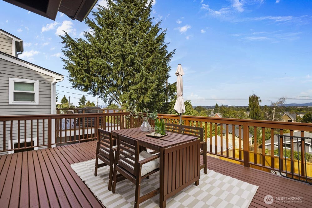5926 34th Avenue Southwest Seattle, WA 98126 - Photo 24 of 36 a view of a balcony with wooden floor and outdoor seating