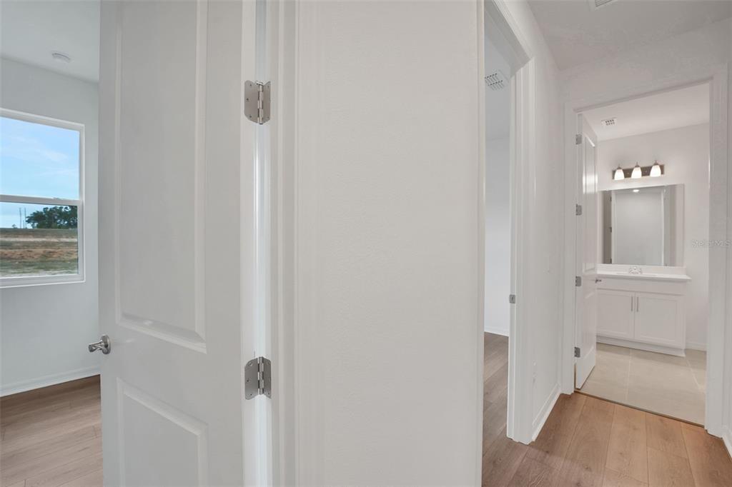 35151 Tuscan Hill Road Dade City, FL 33525 - Photo 28 of 38 a view of a bathroom from the hallway