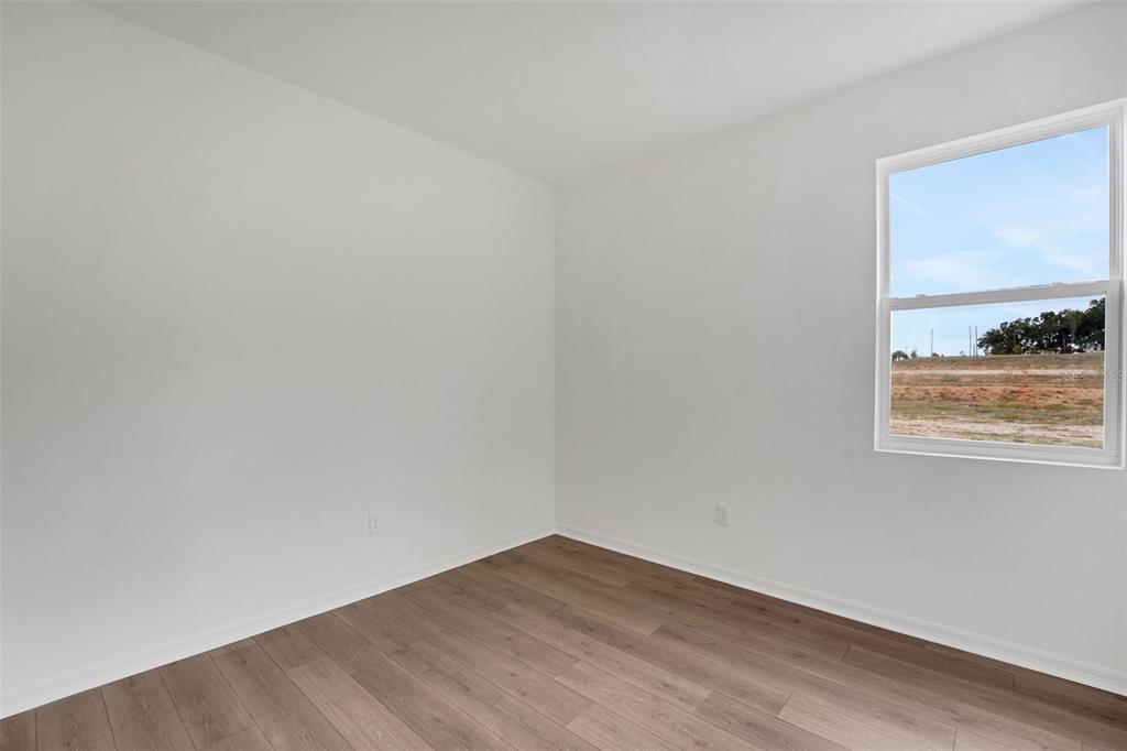 35151 Tuscan Hill Road Dade City, FL 33525 - Photo 29 of 38 a view of a small space with wooden floor and a window