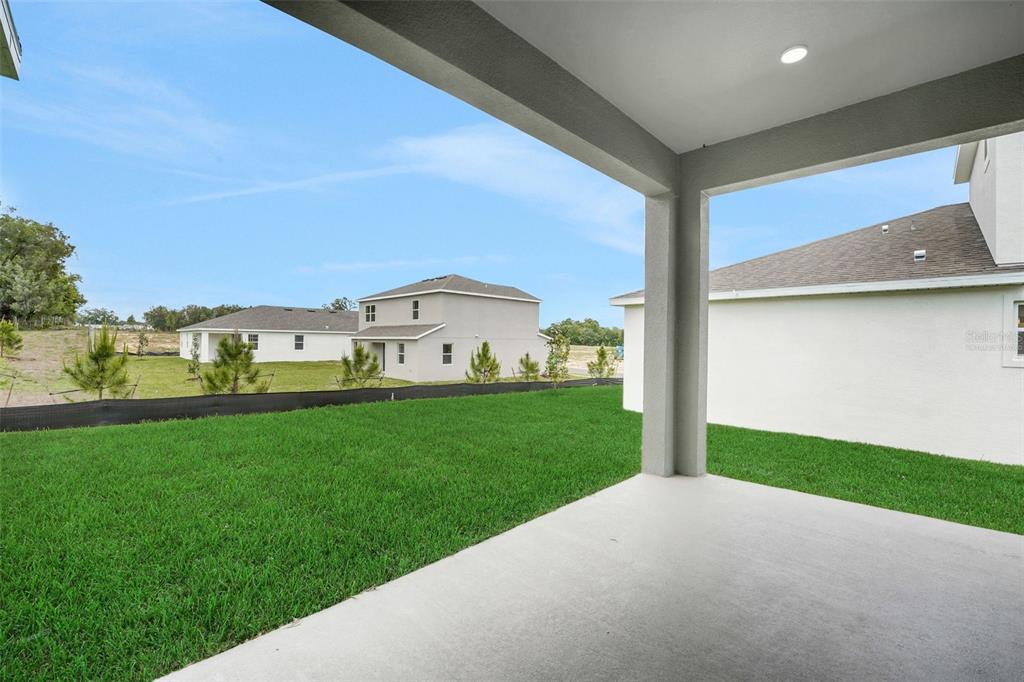 35151 Tuscan Hill Road Dade City, FL 33525 - Photo 35 of 38 a view of a back yard from a room