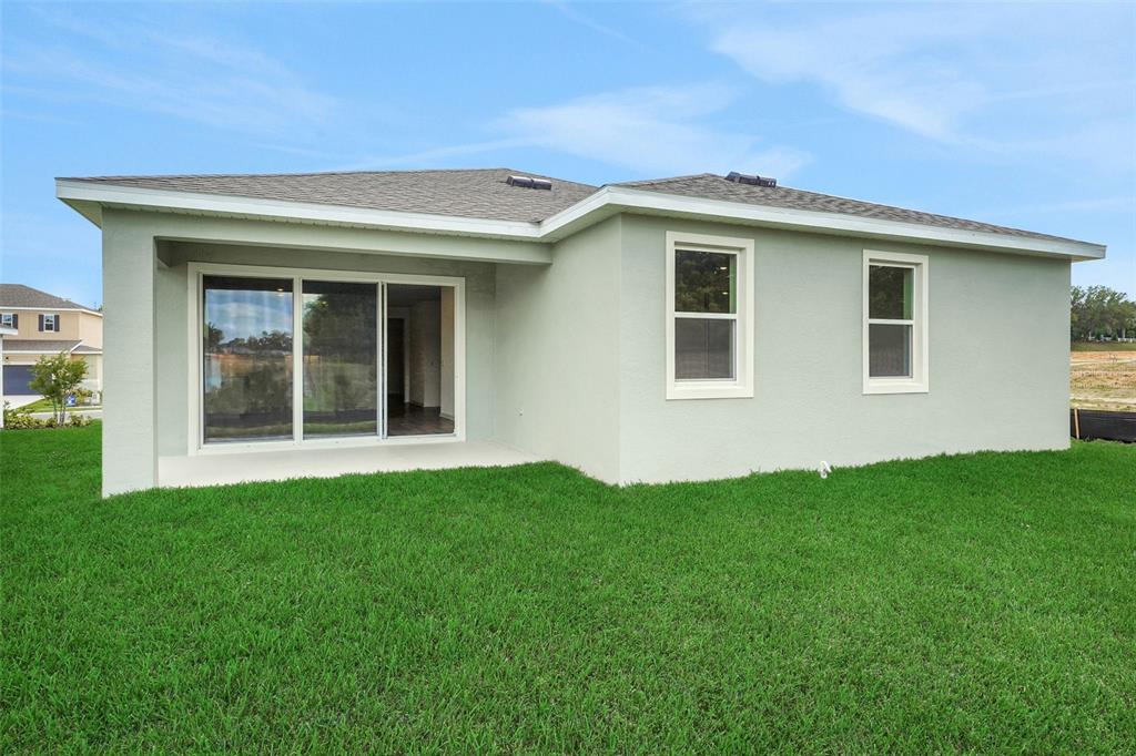 35151 Tuscan Hill Road Dade City, FL 33525 - Photo 37 of 38 a view of an house with backyard space and balcony
