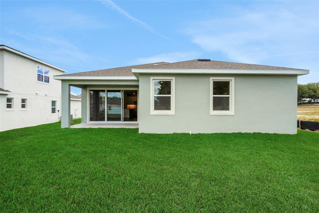 35151 Tuscan Hill Road Dade City, FL 33525 - Photo 38 of 38 a view of a house with backyard