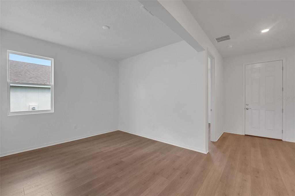 35151 Tuscan Hill Road Dade City, FL 33525 - Photo 8 of 38 a view of a room that has wooden floor in it