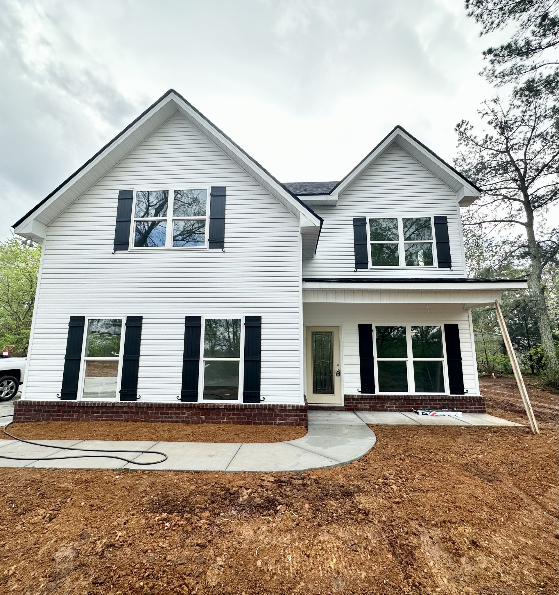 167 Providence Road Pelham, TN 37366 - Photo 1 of 15 a front view of a house with a yard