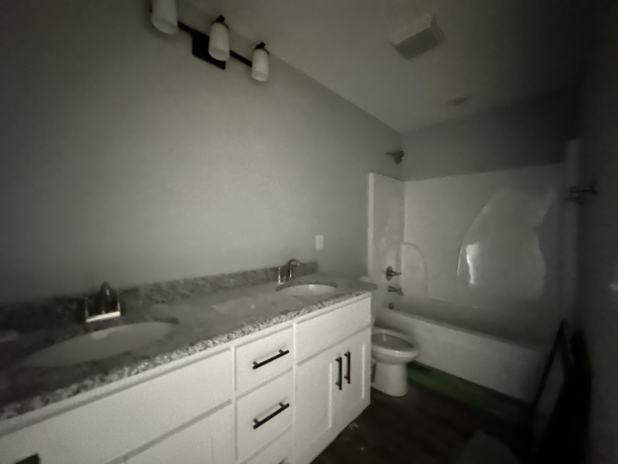 167 Providence Road Pelham, TN 37366 - Photo 12 of 15 a bathroom with a granite countertop sink a toilet and a bathtub