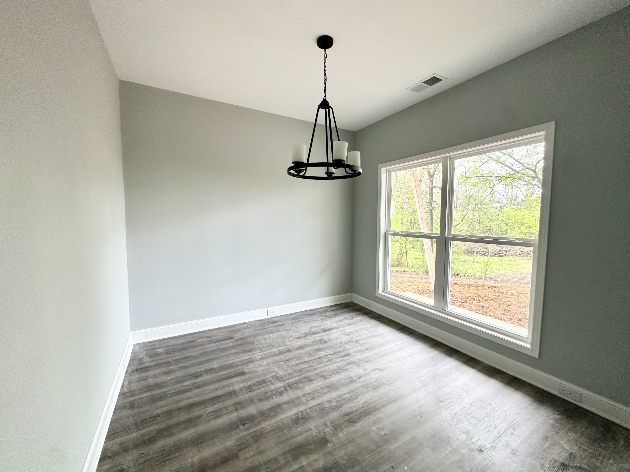 167 Providence Road Pelham, TN 37366 - Photo 3 of 15 a view of an empty room with wooden floor and a window