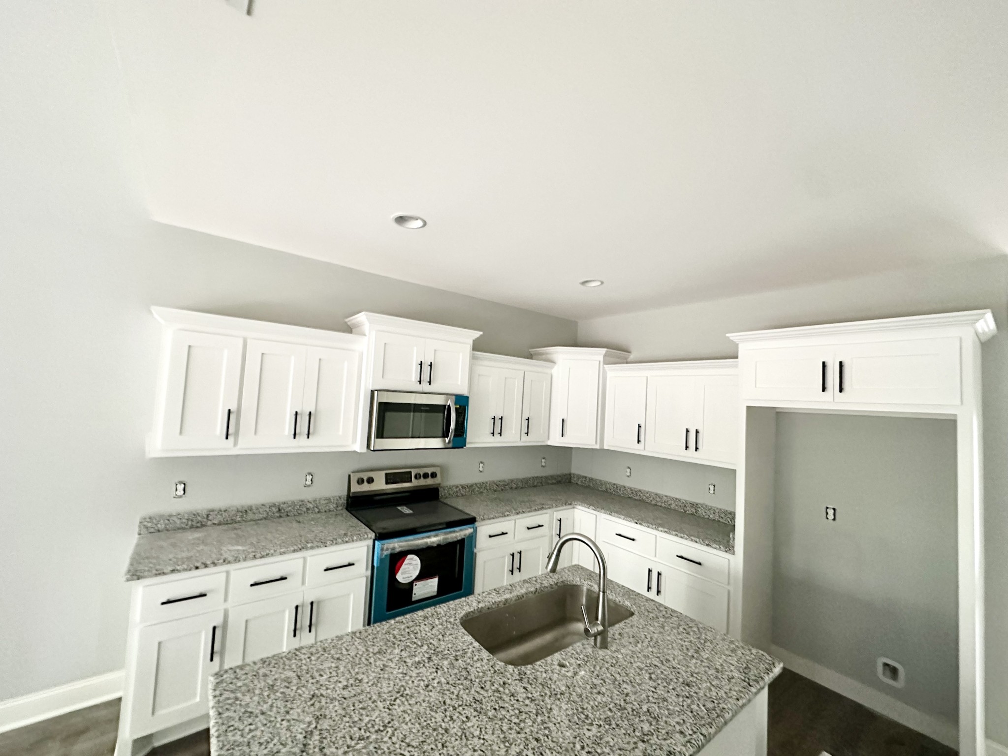 167 Providence Road Pelham, TN 37366 - Photo 5 of 15 a kitchen with granite countertop a refrigerator stove and sink