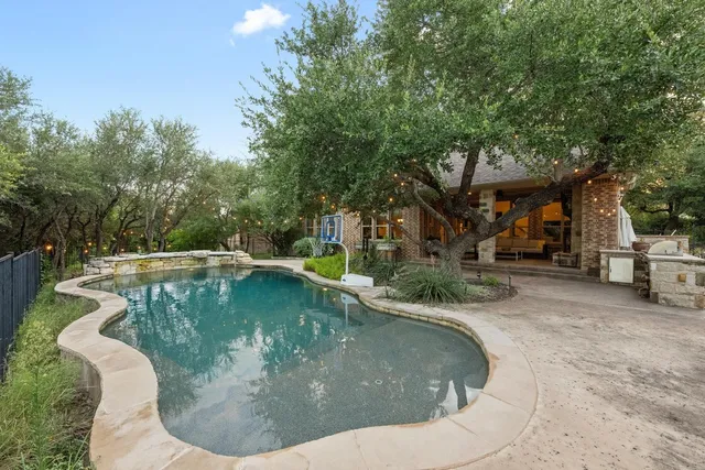 a view of a swimming pool with a sitting area