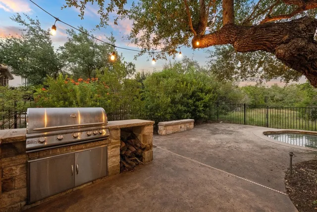 a view of a room with wooden walls and iron fence