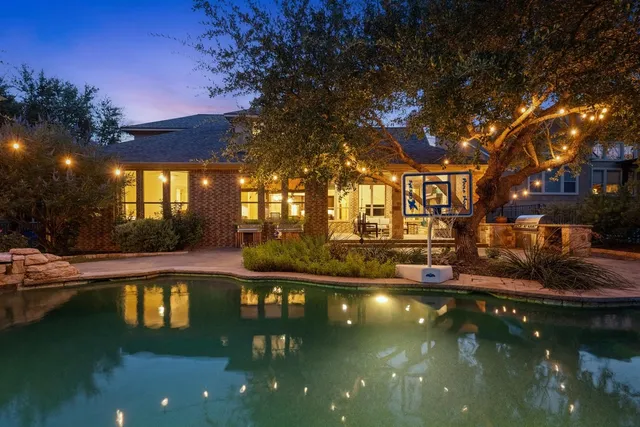 a view of a swimming pool with an outdoor space and seating area