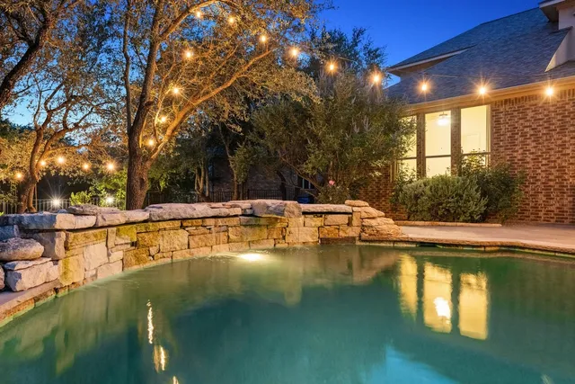 a view of a swimming pool with an outdoor seating