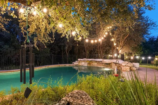 a view of swimming pool from a garden