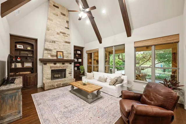 a living room with furniture fireplace and a flat screen tv