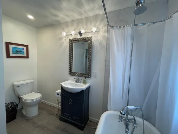 a bathroom with a sink toilet and shower