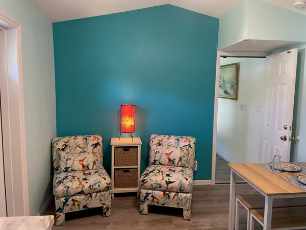 a bedroom with furniture and a chair