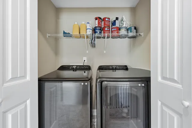 a view of storage and utility room with washer and dryer