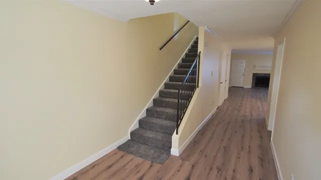 a view of entryway with wooden floor