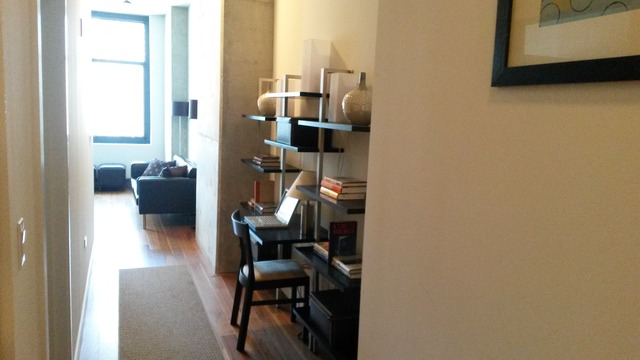 235 West Van Buren Street, Unit 3620 Chicago, IL 60607 - Photo 4 of 12 a view of living room with furniture and wooden floor