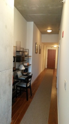 235 West Van Buren Street, Unit 3620 Chicago, IL 60607 - Photo 6 of 12 a view of a hallway with workspace