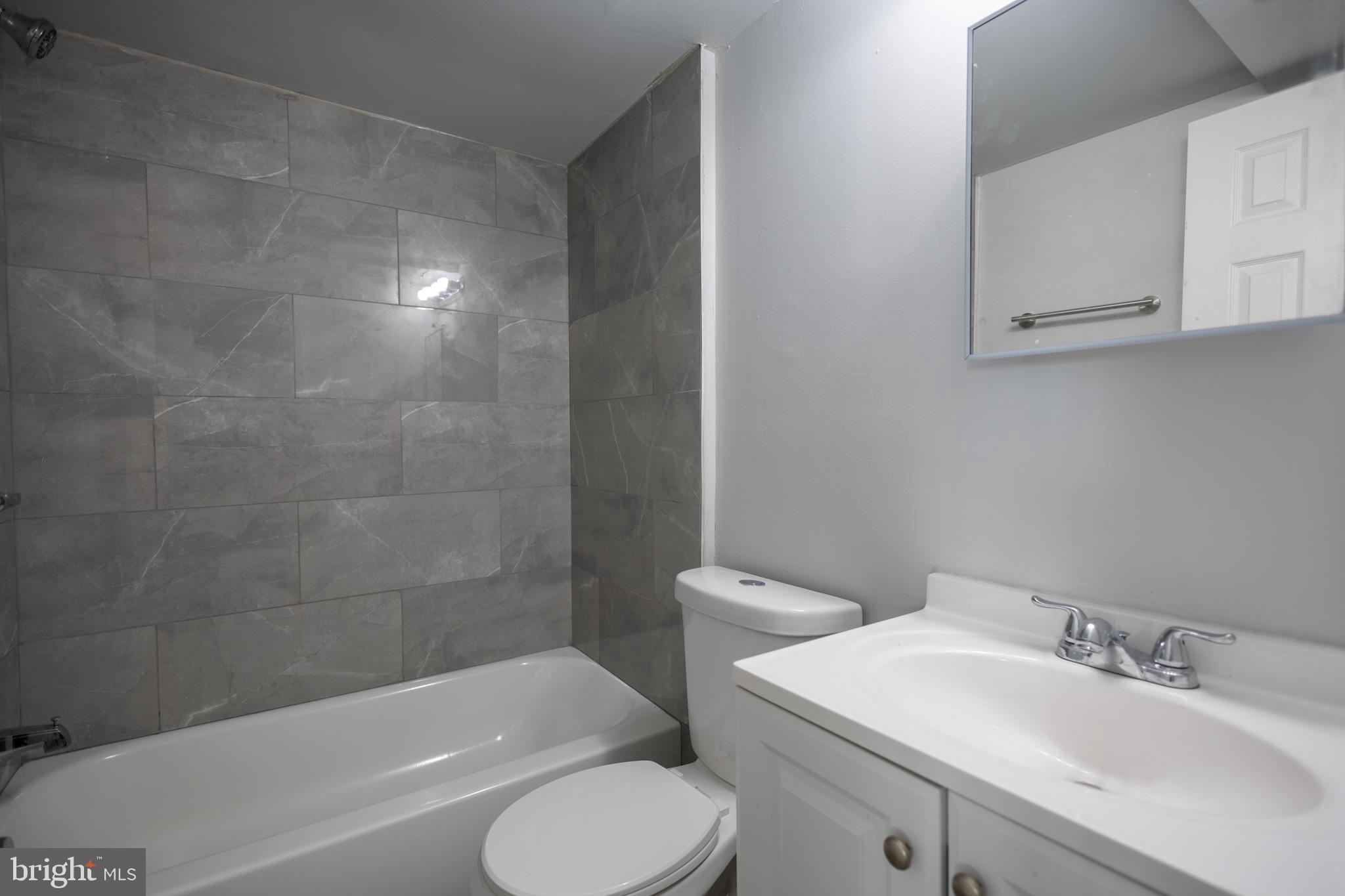 1300-1302 Morris Road Southeast, Unit A6 Washington, DC 20020 - Photo 13 of 13 a bathroom with a sink toilet and bathtub