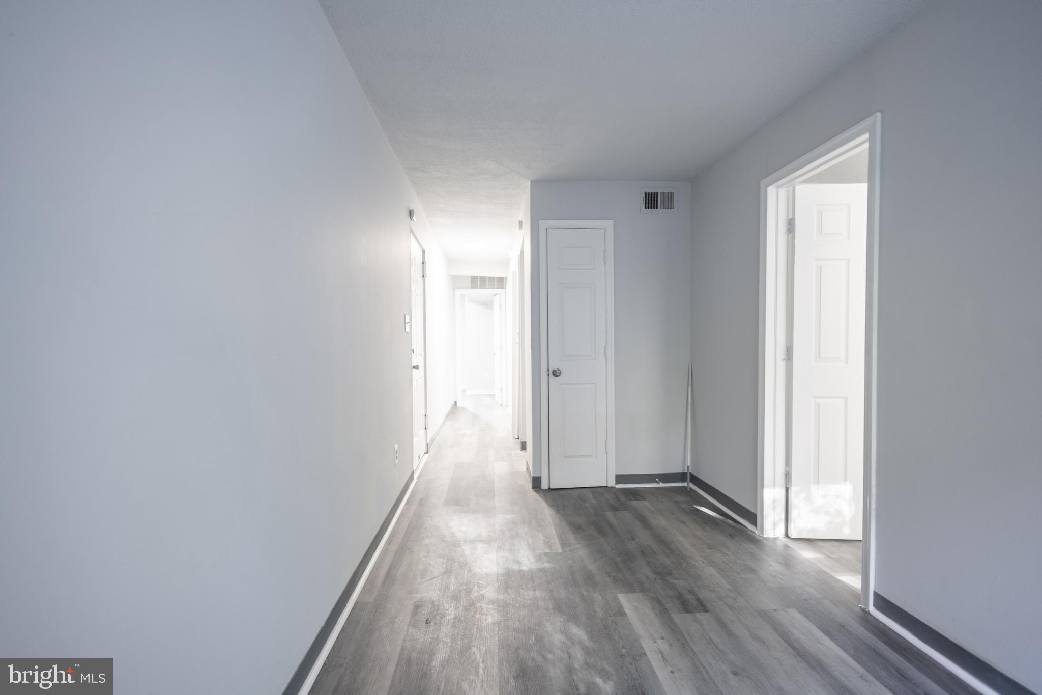 1300-1302 Morris Road Southeast, Unit A6 Washington, DC 20020 - Photo 8 of 13 a view of hallway with wooden floor