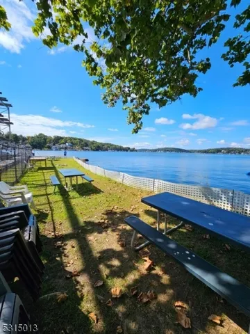 a view of a swimming pool with a lounge chair