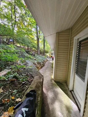 a view of a backyard with pathway