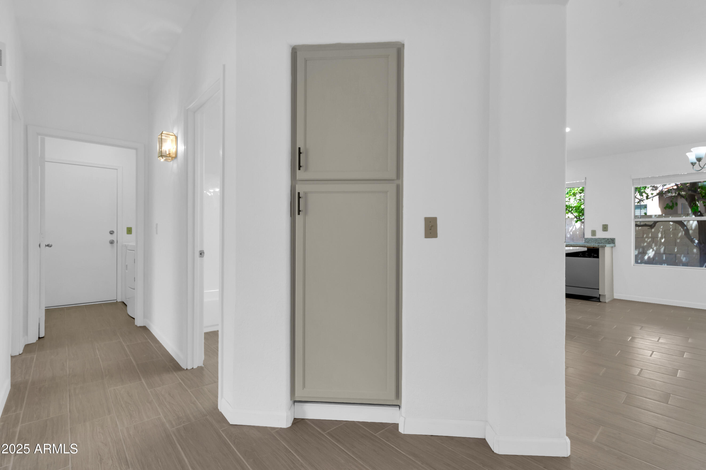 1511 West Wildhorse Court Chandler, AZ 85286 - Photo 10 of 31 a view of a hallway with wooden floor windows and cabinet