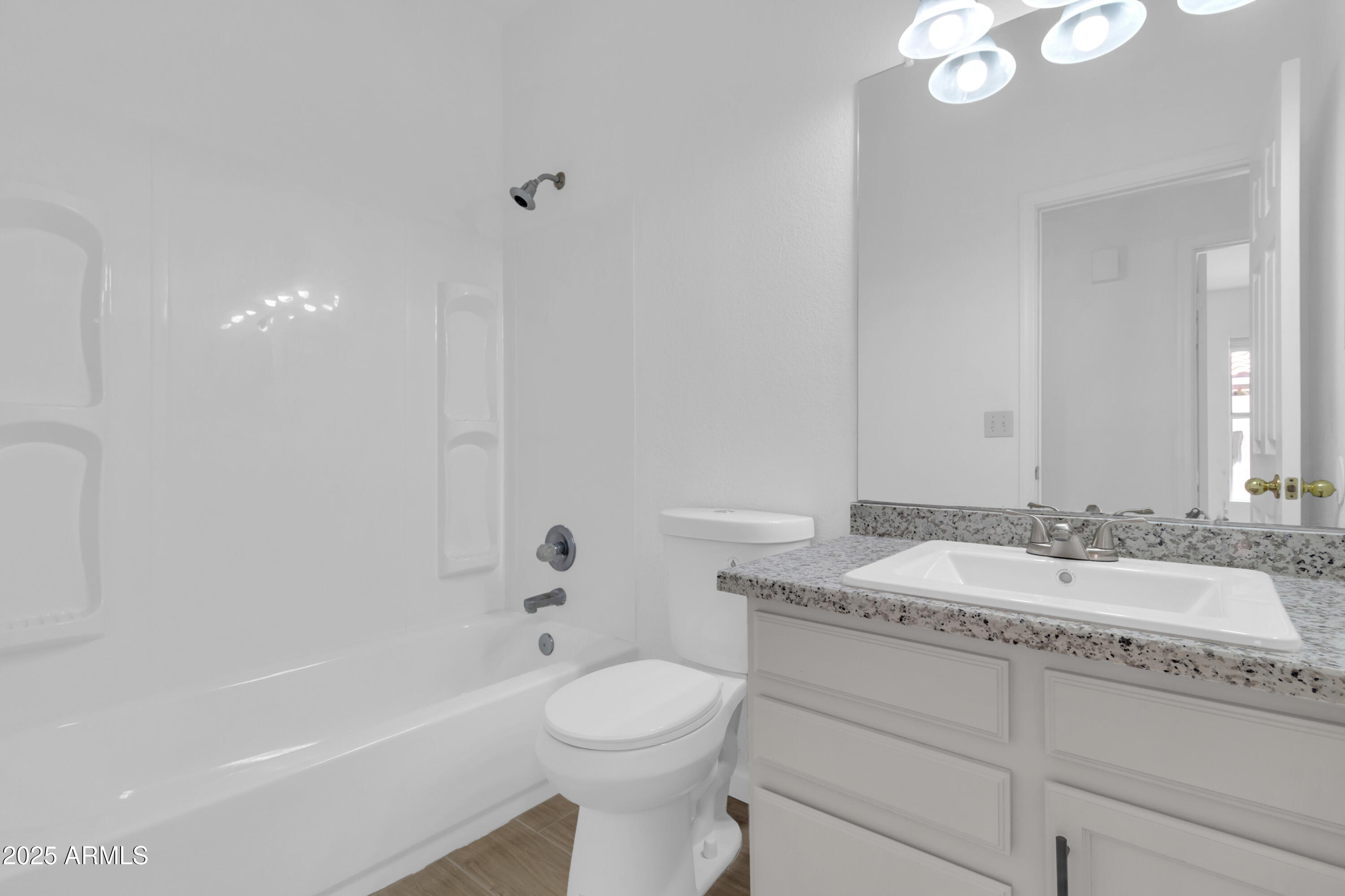1511 West Wildhorse Court Chandler, AZ 85286 - Photo 11 of 31 a bathroom with a granite countertop sink mirror vanity and toilet