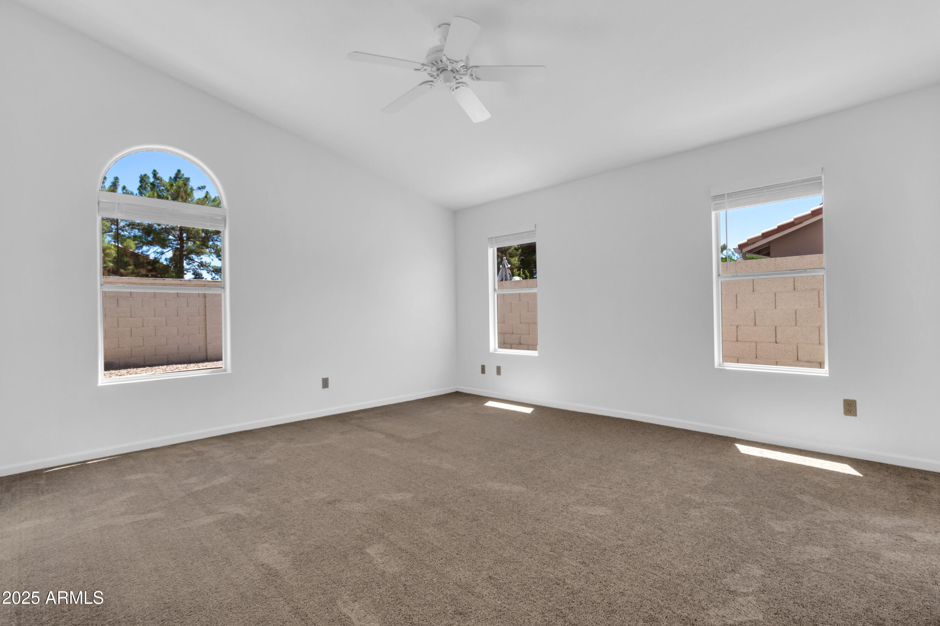 1511 West Wildhorse Court Chandler, AZ 85286 - Photo 15 of 31 an empty room with windows and fan