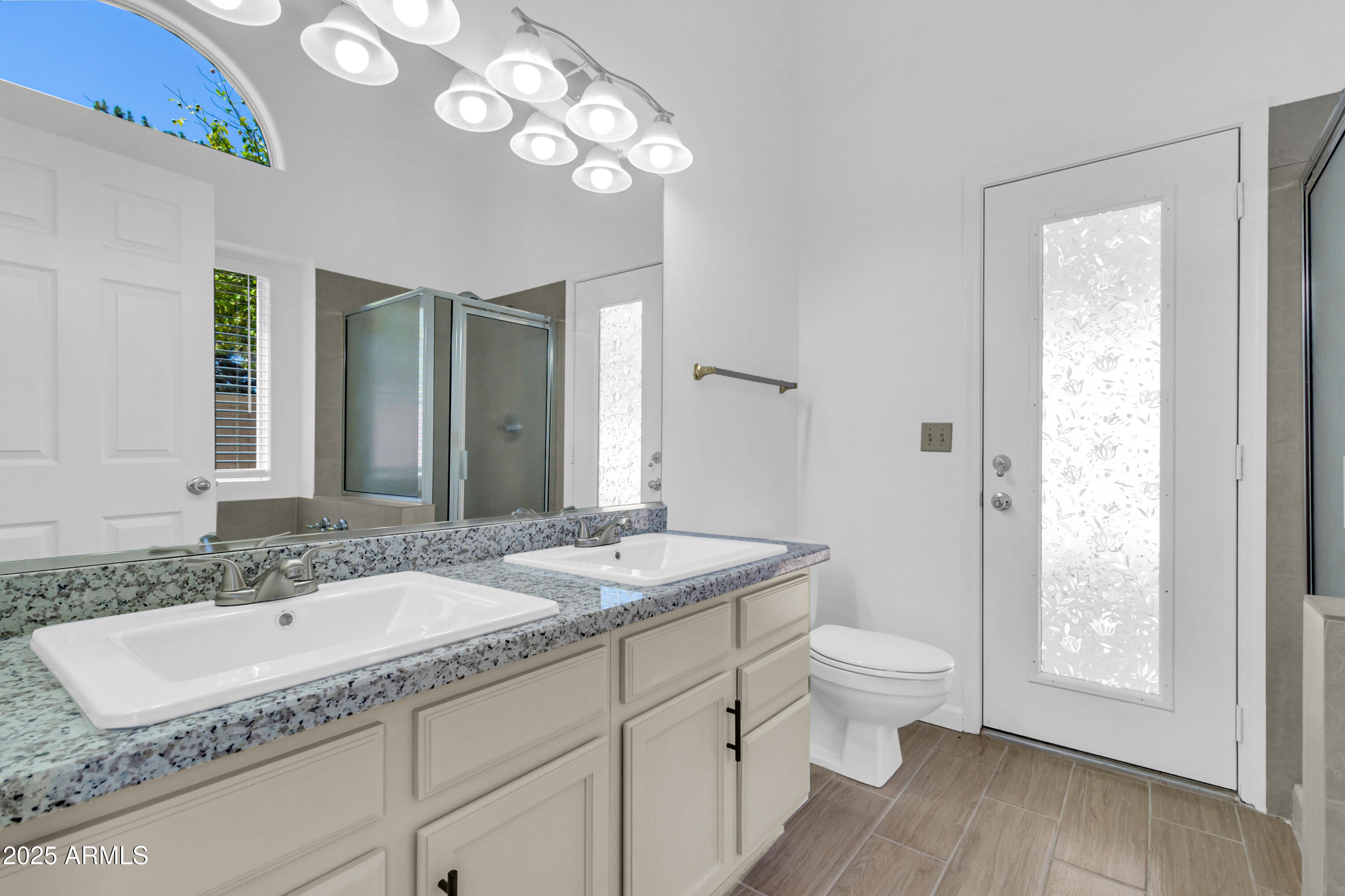 1511 West Wildhorse Court Chandler, AZ 85286 - Photo 21 of 31 a bathroom with a granite countertop sink and a mirror