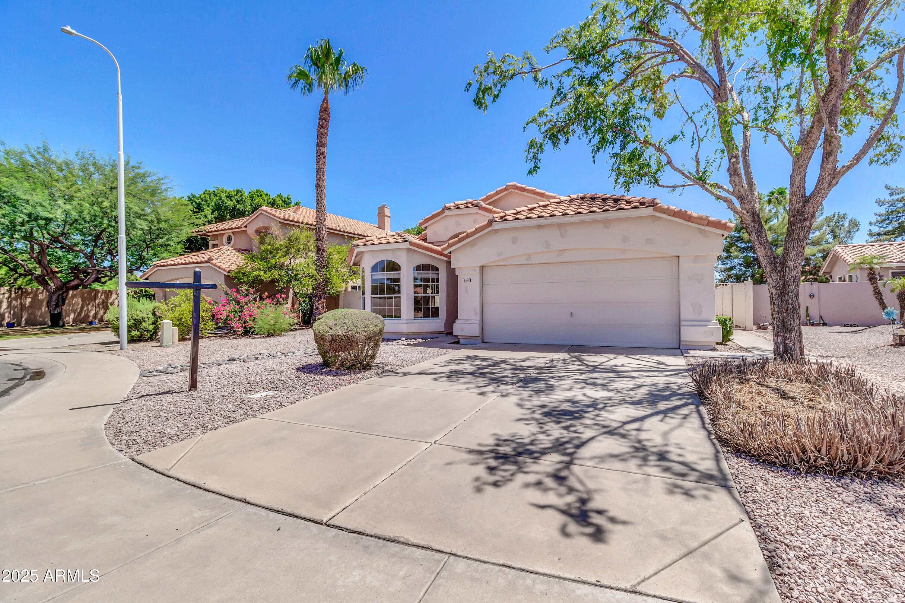 1511 West Wildhorse Court Chandler, AZ 85286 - Photo 2 of 31 a front view of a house with garden