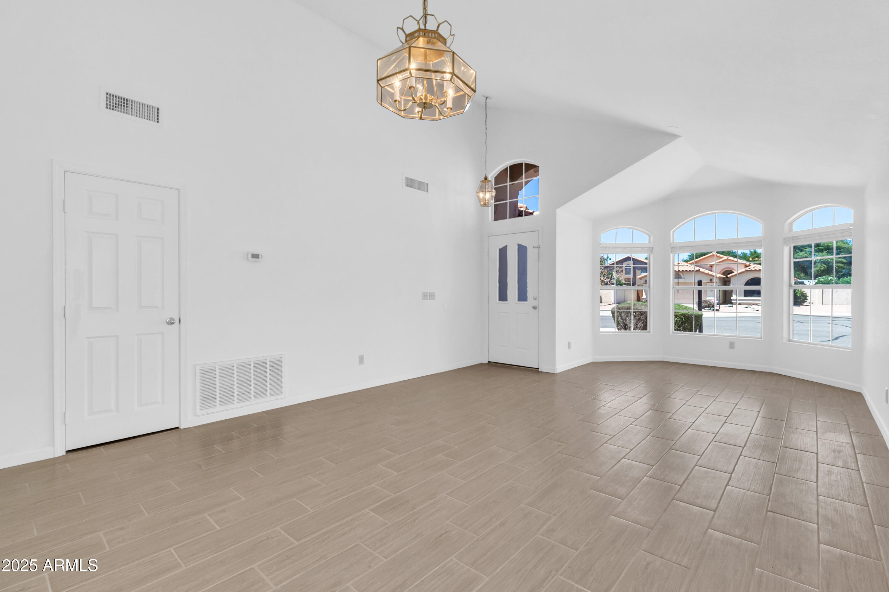 1511 West Wildhorse Court Chandler, AZ 85286 - Photo 3 of 31 an empty room with windows