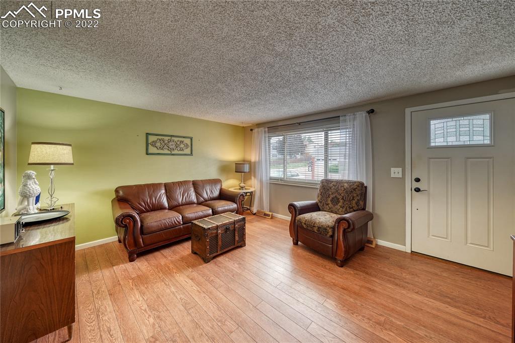 7035 Chippewa Road Colorado Springs, CO 80915 - Photo 14 of 22 a living room with furniture and a window