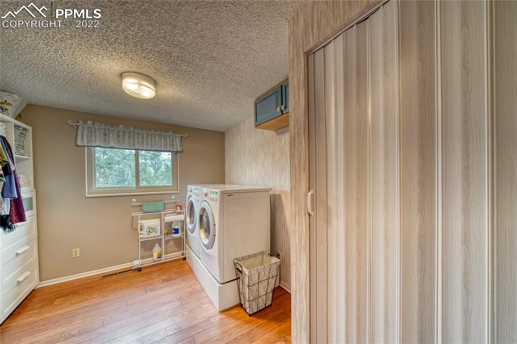 7035 Chippewa Road Colorado Springs, CO 80915 - Photo 19 of 22 a view of a room with wooden floor and chair