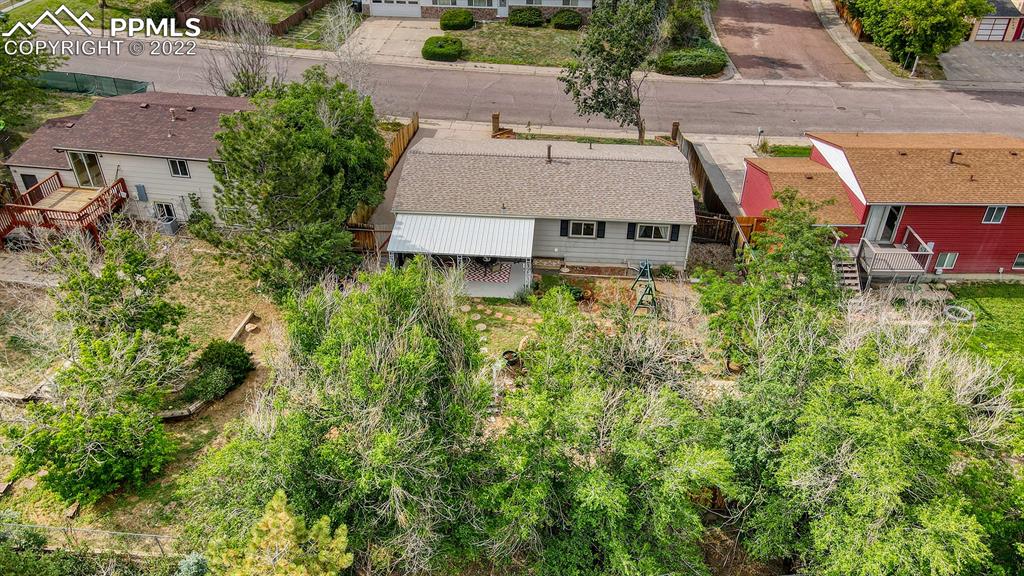 7035 Chippewa Road Colorado Springs, CO 80915 - Photo 3 of 22 an aerial view of residential houses with outdoor space and trees