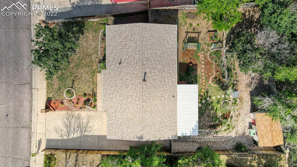 7035 Chippewa Road Colorado Springs, CO 80915 - Photo 4 of 22 aerial view of a house with a yard and plants
